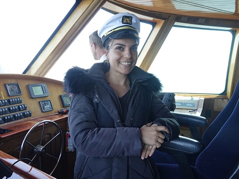 A staff member on board a whale watching vessel