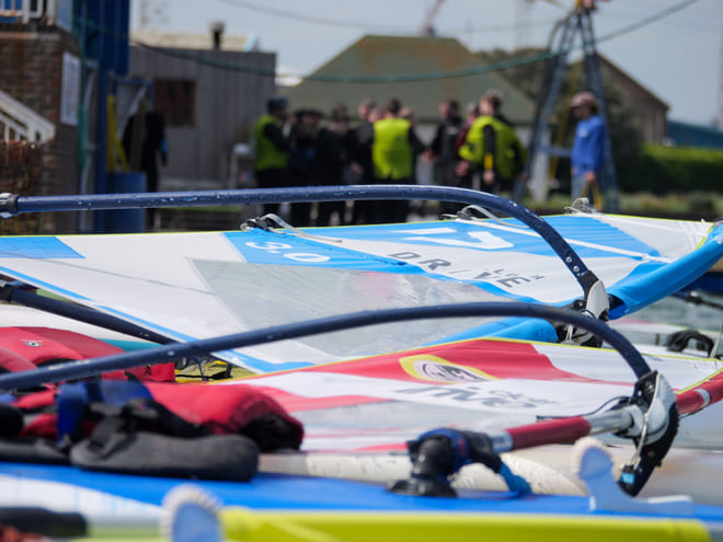 Catch the wind and speed across the water in a introductory windsurfing session