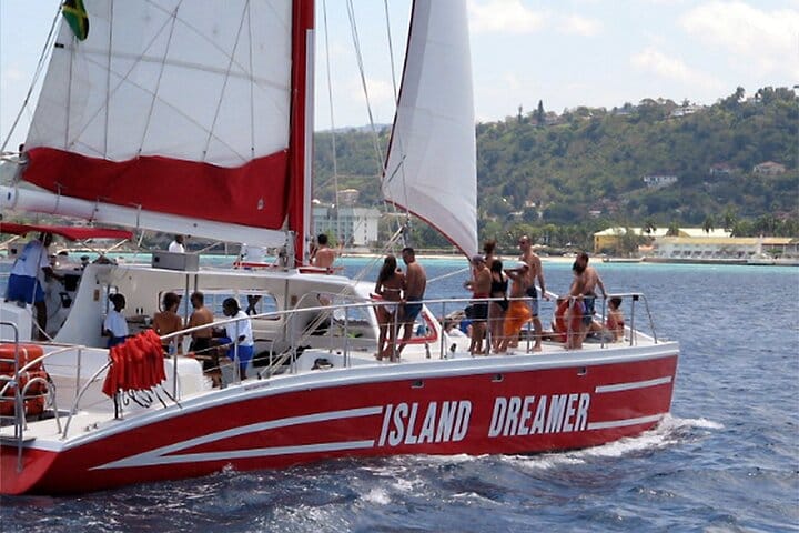 Feel the rhythm and dance the day away on the most energetic party cruise in Jamaica aboard the Montego Bay Catamaran!