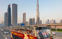 "A group of tourists takes in the sights of Dubai from the Big Bus, making their visit a memorable and enjoyable experience."