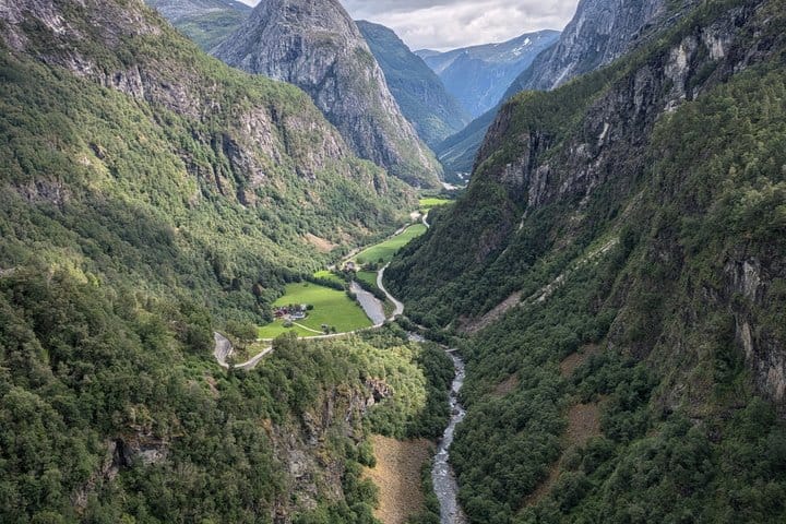 Winding river and railway through the steep Flåm Valley