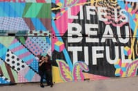 Photo opportunity by one of dozens of art murals on East Fremont Street