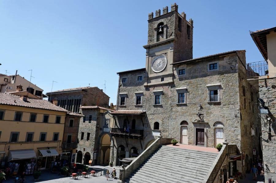 View of one of Cortona's most beautiful medieval buildings with its stone staircase and clocktower