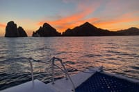 Experience the magical transformation of Cabo's Land's End as the sunset paints the sky and silhouettes the legendary granite peaks on your iconic catamaran cruise.