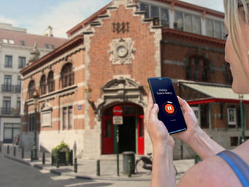 Visit Brussels in freedom: In front of the Halles Saint-Géry and the trendy district.