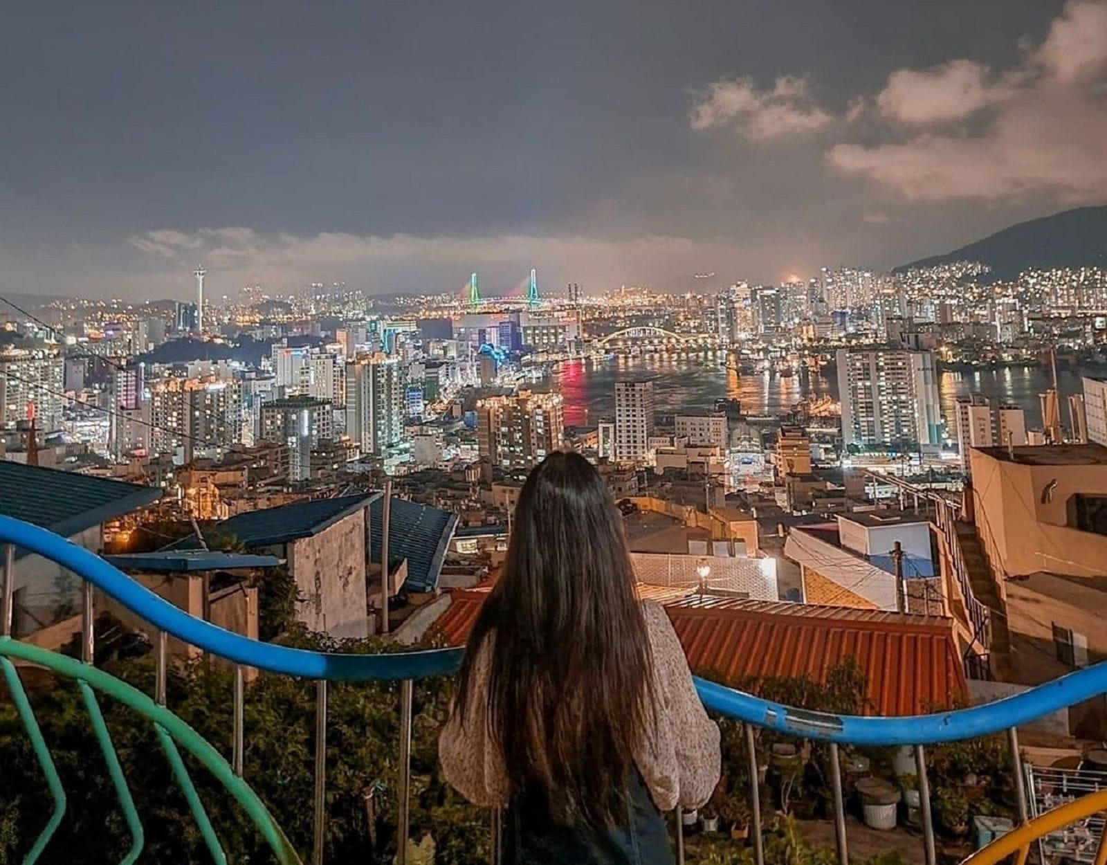 A scenic photo spot overlooking Busan city from Cheonmasan Observatory at night.
