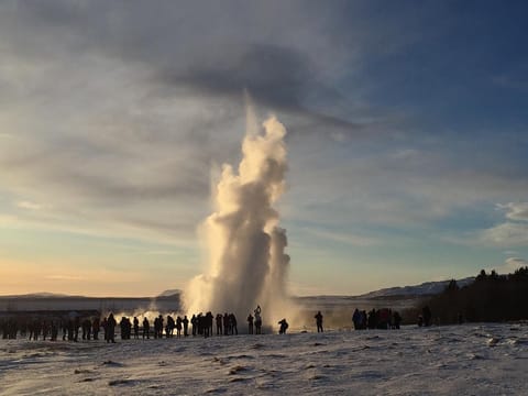 Strokkur geysir erupting at Geysir, Haukadal during winter