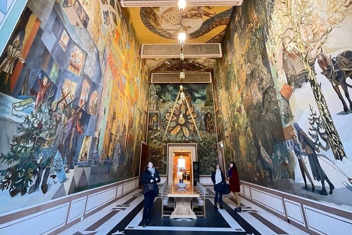 Inside a building fresco paintings on all walls