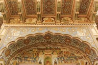 A hand painted fresco with a religious scene is painted on the wall of a Haveli in Mandawa