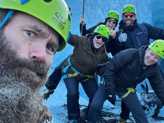 People fooling around for a fun photo on the glacier