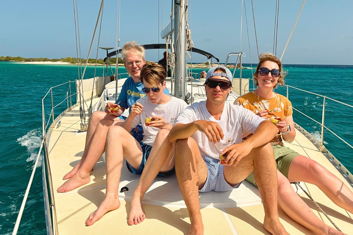 Family enjoying sailing Caribbean Sea during a private tour by Maxie Sailing in Curacao