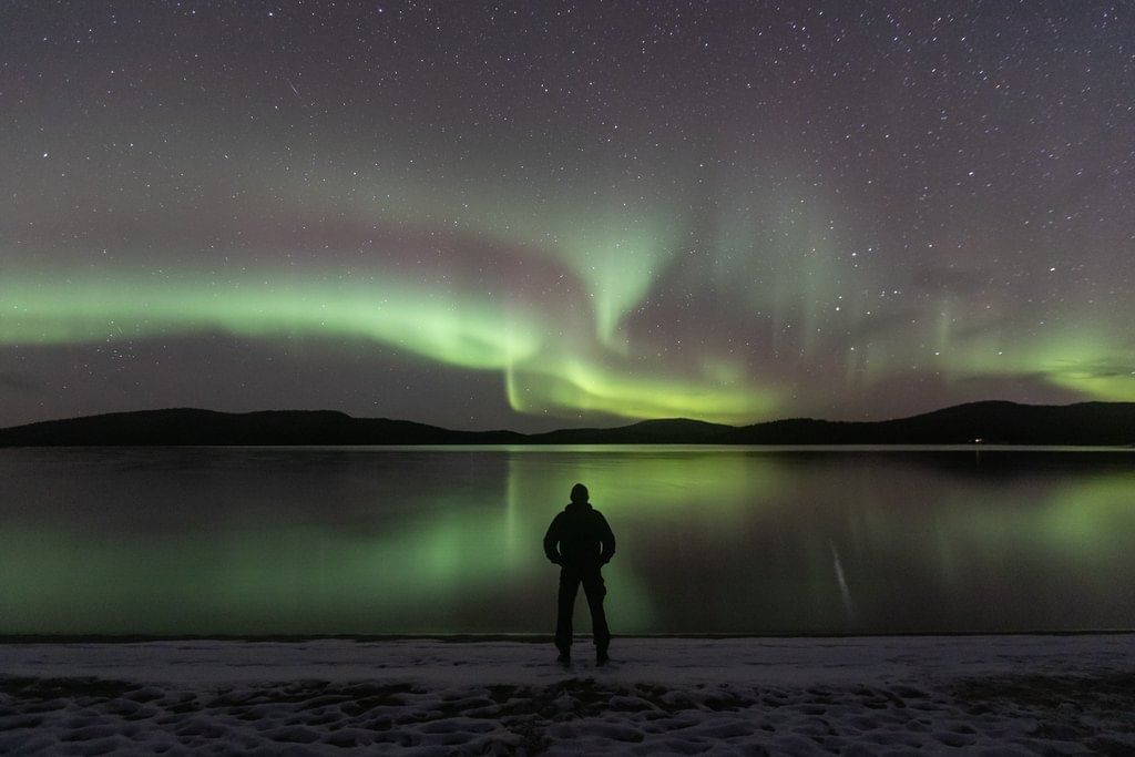 Northern Lights reflecting from water in late autumn.
