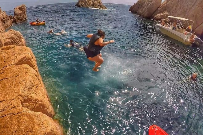 Enjoy dives from cliffs in a secluded bay.