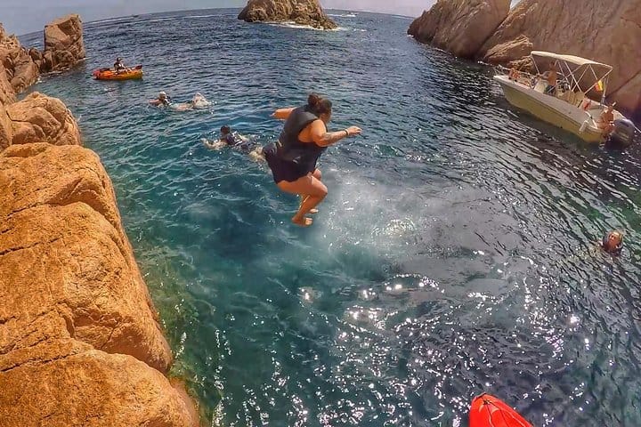 Enjoy dives from cliffs in a secluded bay.