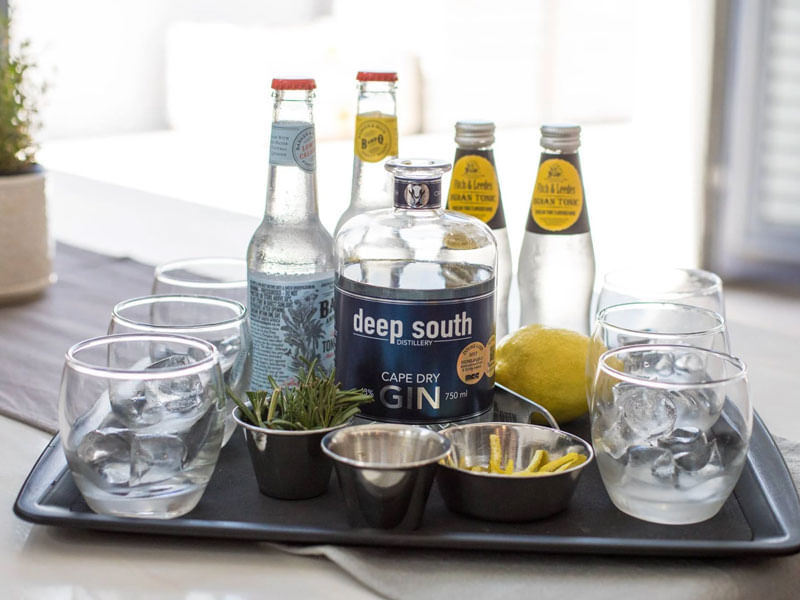 Savor artisan gins with aromatic garnishes, celebrating the vibrant flavors of the region.