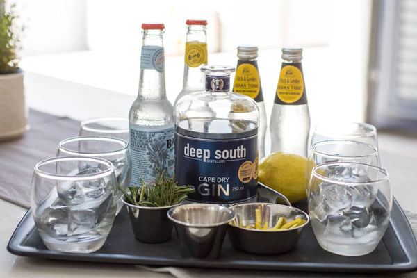 Savor artisan gins with aromatic garnishes, celebrating the vibrant flavors of the region.
