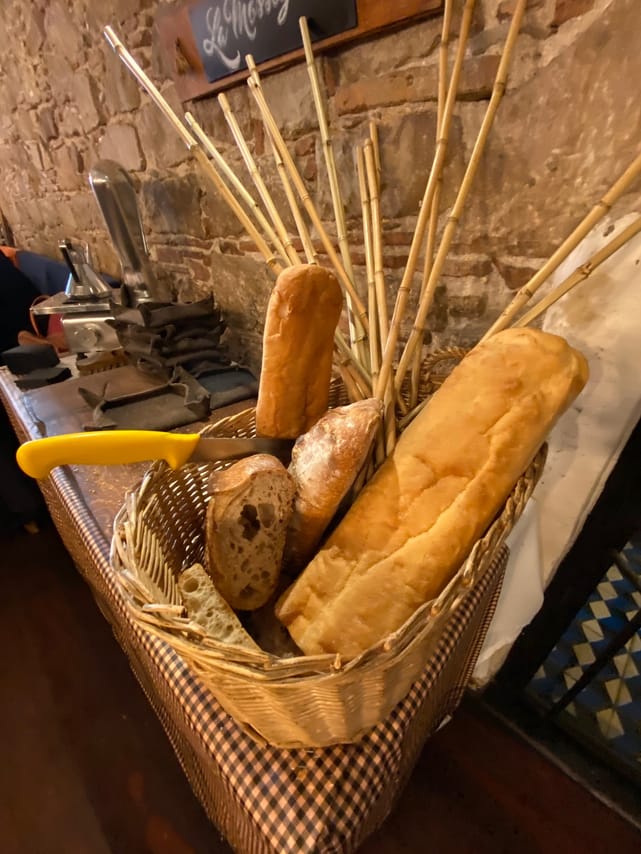 A bread basket with a knife