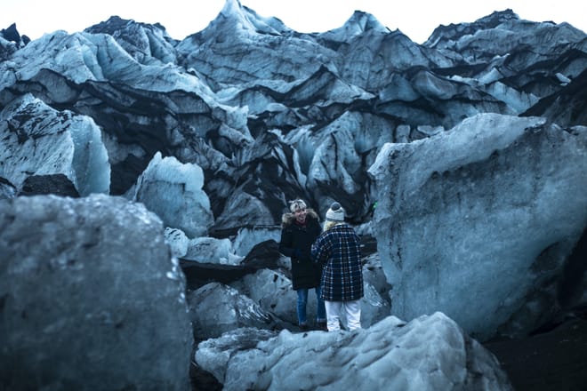 Having a casual chat in surreal surroundings at Sólheimajökull glacier