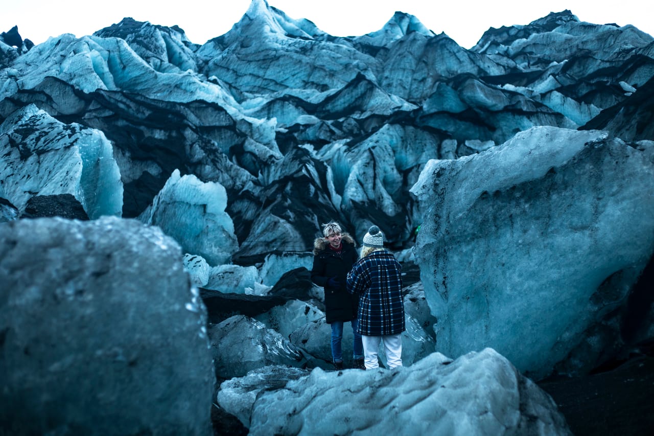 Having a casual chat in surreal surroundings at Sólheimajökull glacier
