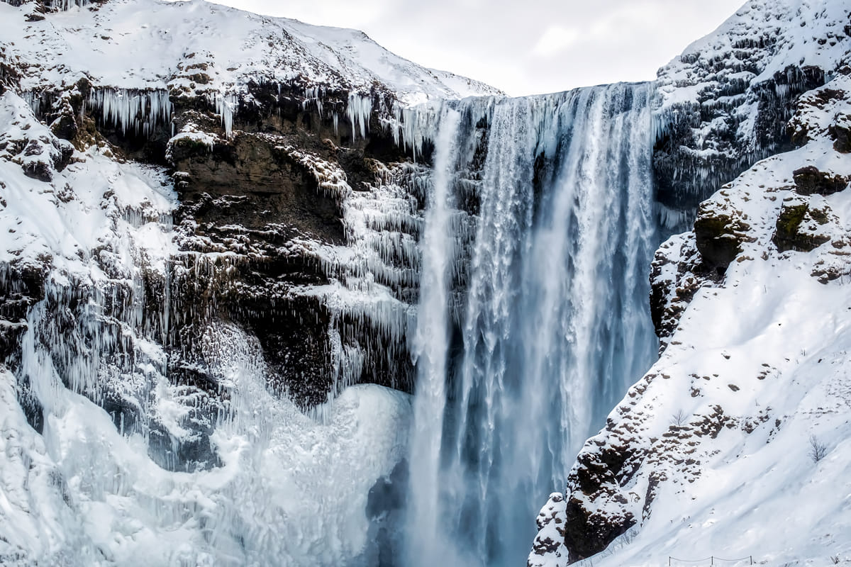 Skogafoss with ice and snow in winter