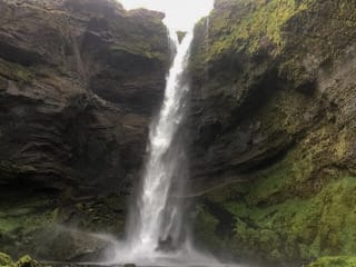 Kvernufoss seen from the path in the canyon
