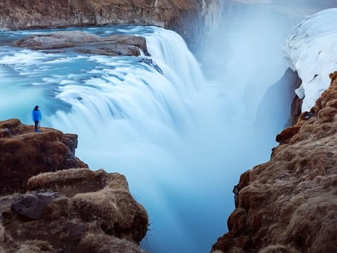 Tourists enjoying Gullfoss waterfall during summer in Iceland