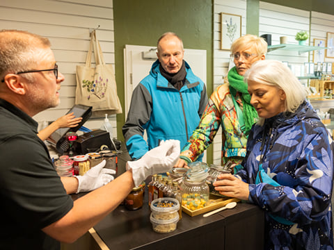 A tour group sampling various Icelandic specialities during a private tour