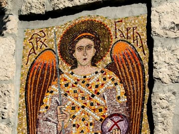 Discover the medieval Kom Monastery, hidden atop Odrin Hill, accessible only by boat.