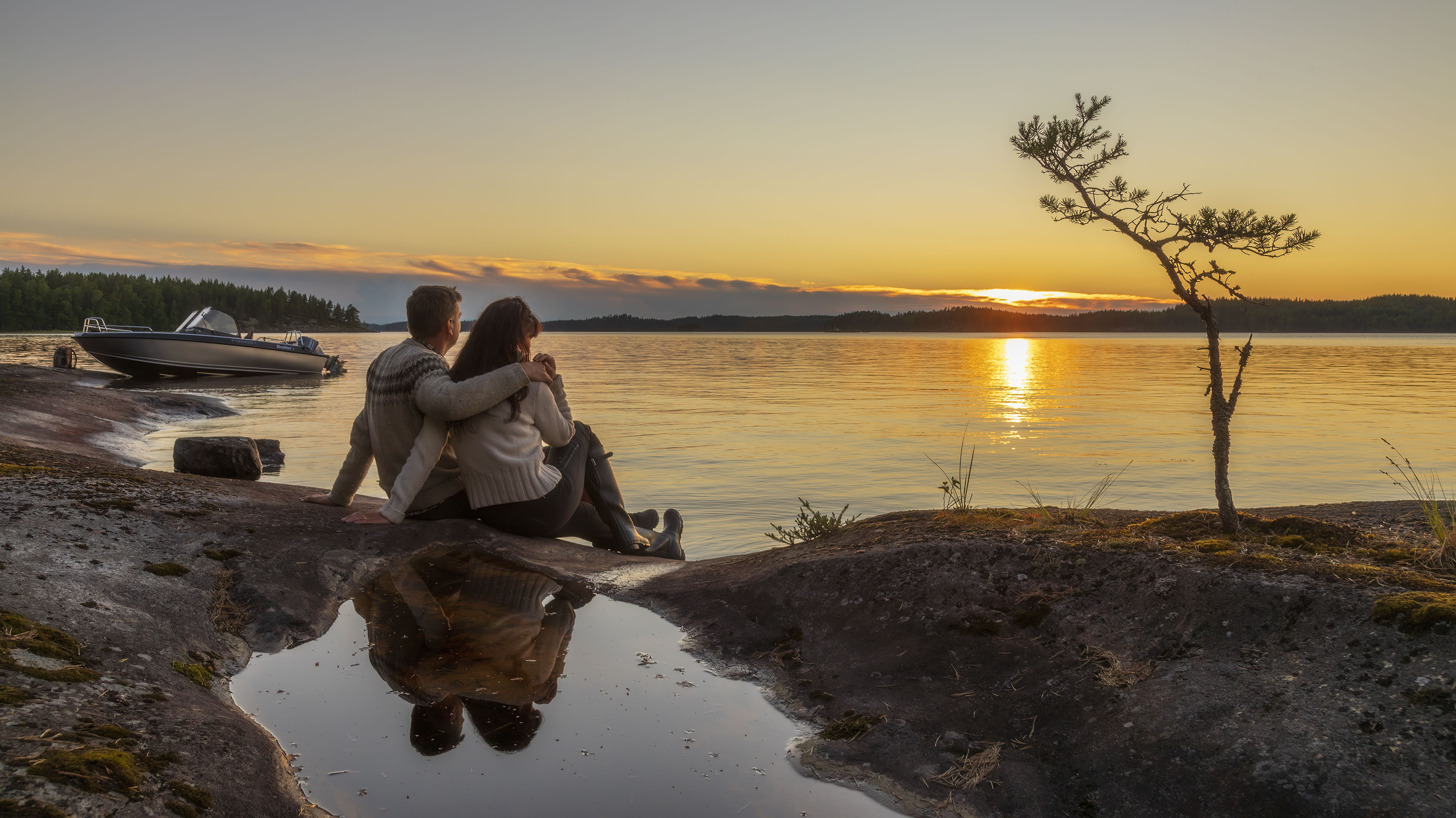 A couple watching sun to set