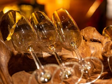 Ready to pour — Wine glasses stand at attention for tonight’s expertly curated pairings.