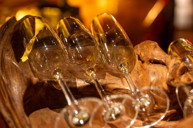 Ready to pour — Wine glasses stand at attention for tonight’s expertly curated pairings.
