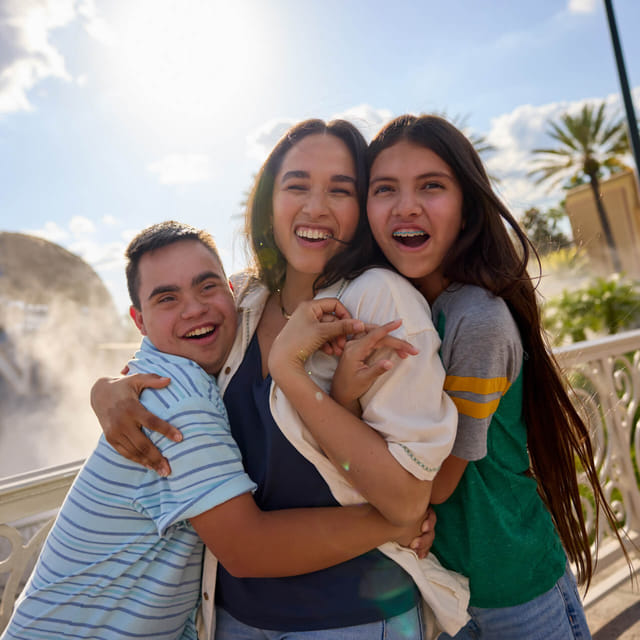 Family beside the Universal globe