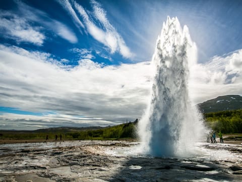 spouting hot spring Strokkur gushing water into the air
