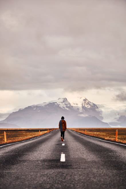 Walking along empty road in Vatnajökull National Park