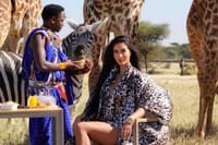 ​A luxury traveler in a private sanctuary featuring Maasai heritage and close wildlife interaction.