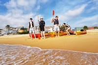 Getting ready for the sea kayaking experience on the beach in the Costa Brava.