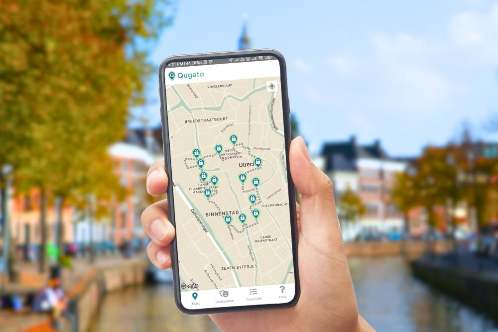 Phone showing the Qugato app interface of the Groningen City Detective game.