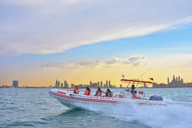 Catch the stunning Dubai skyline at sunset as you race across the waves aboard the exhilarating LOVE BOATS Speedboat!