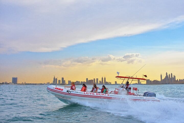 Catch the stunning Dubai skyline at sunset as you race across the waves aboard the exhilarating LOVE BOATS Speedboat!