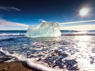 Iceberg coming to shore at Glacier Lagoon