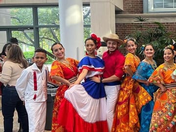 Group of people wearing folk costumes in Santo Domingo