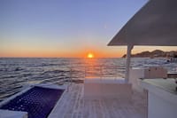 Watch the Pacific Ocean ignite in fiery color from the best seat in the house—the tranquil deck of your iconic Los Cabos sunset catamaran cruise.