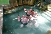Family enjoying warm mineral bath
