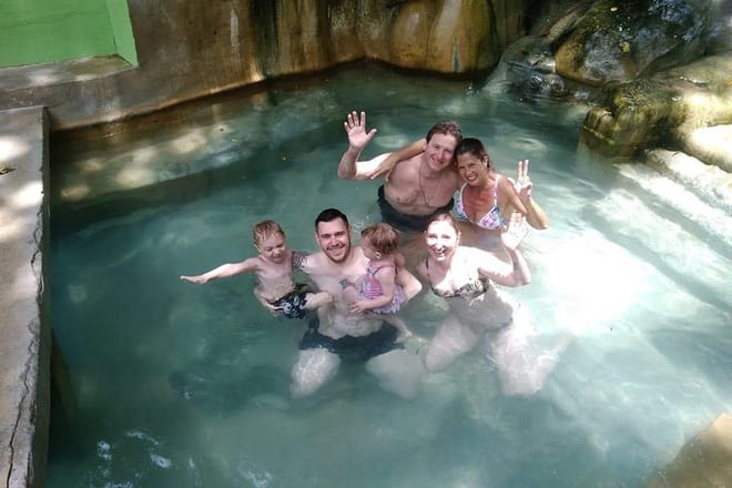 Family enjoying warm mineral bath