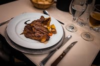 Traditional Argentine food and wine served during an evening tango show in Buenos Aires.