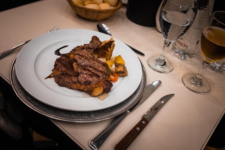 Traditional Argentine food and wine served during an evening tango show in Buenos Aires.