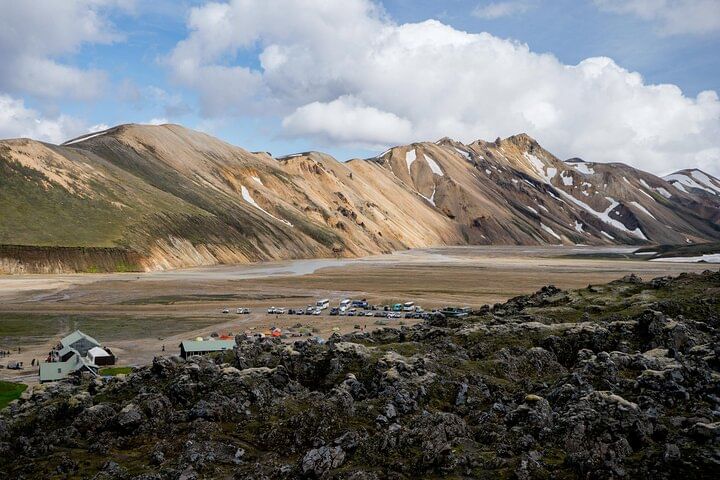 Standing on the lava field in Landmannalaugar looking over to the huts. The most characteristic mountain Mt. Barmur in back