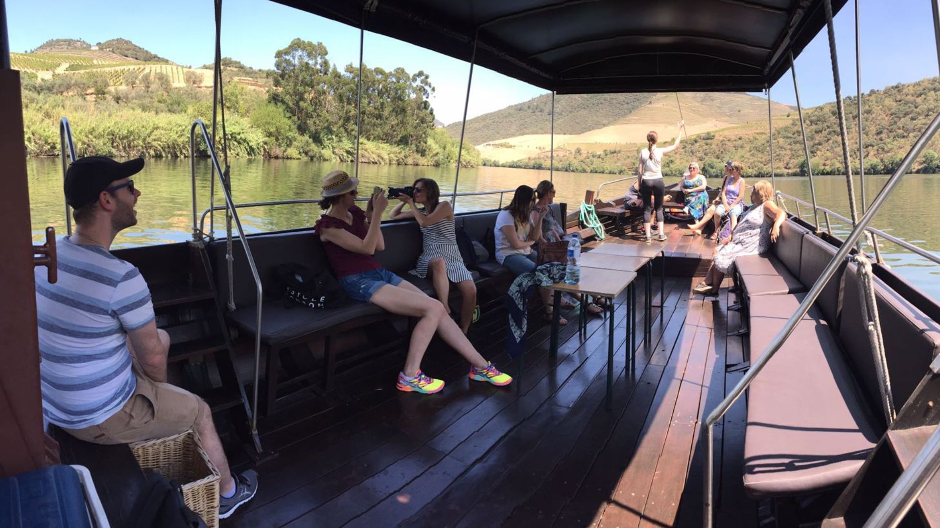 Image of small group guests enjoying a private Boat Cruise from Pinhão on Cooltour Oporto's Douro Valley Wine Tour from Porto