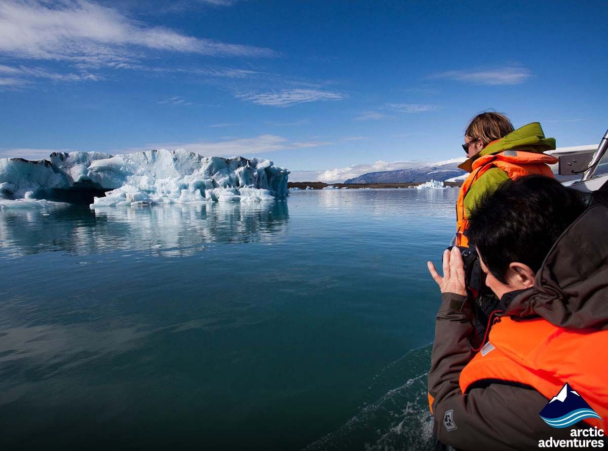 people photographing glacier during 2 day south coast tour Iceland