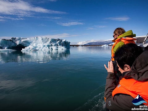 people photographing glacier during 2 day south coast tour Iceland